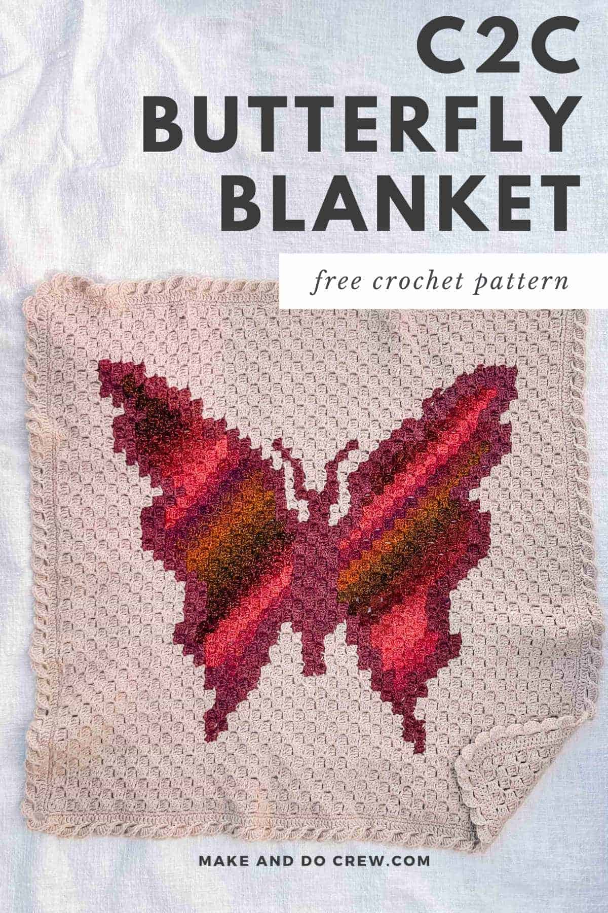A c2c crochet butterfly blanket laying on a white background.