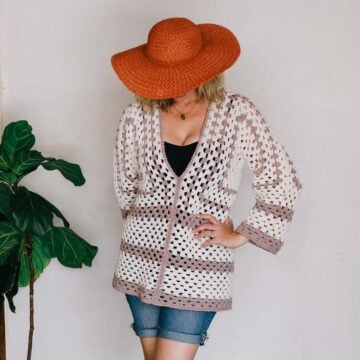 Crochet hexagon pool coverup modeled by a woman wearing a sunhat.
