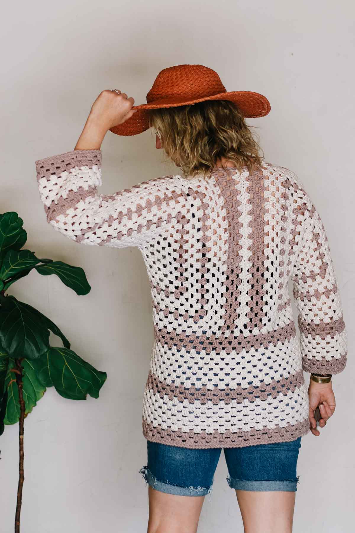 Back view of a crochet coverup made from granny stitch hexagons.