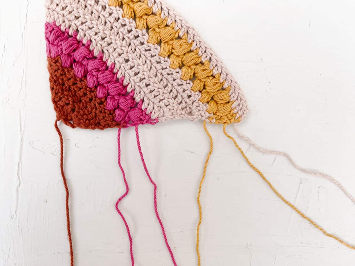 Tutorial on how to weave the ends of multiple yarn colors.