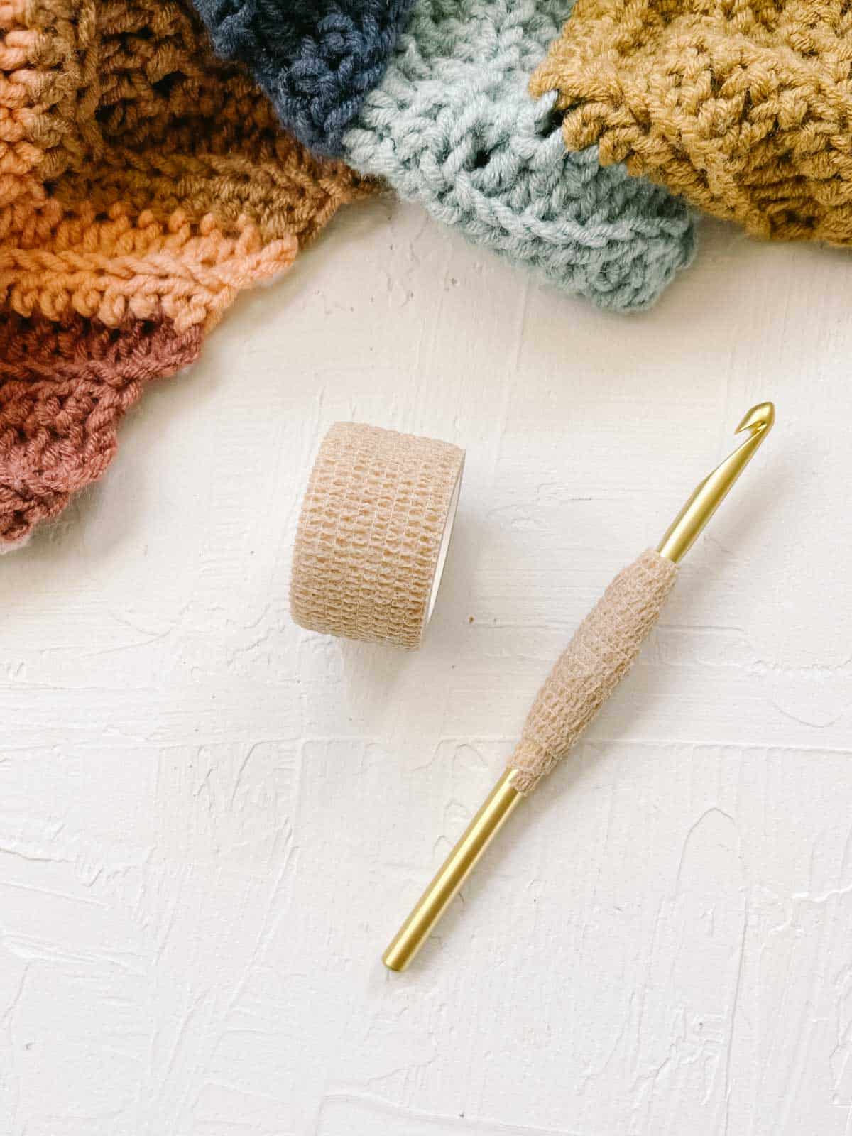 Making an ergonomic crochet handle with a tensor bandage for added comfort.