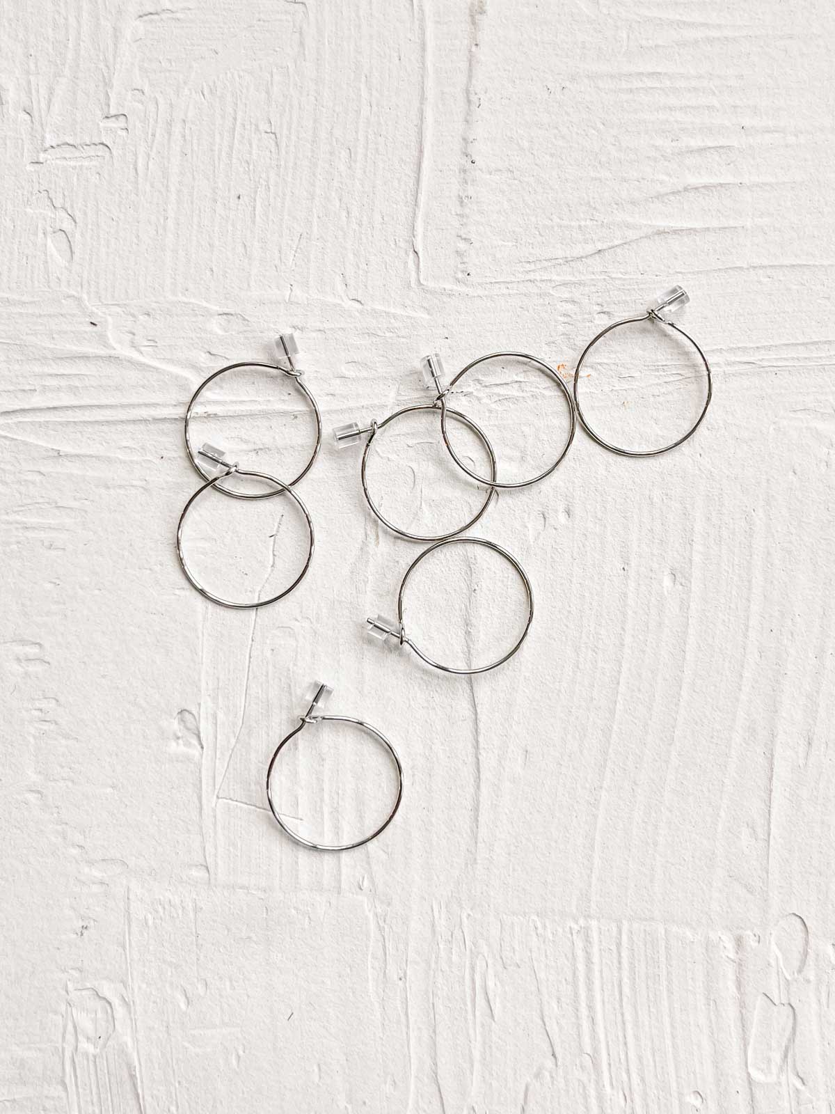 Silver hoop earrings to be used as stitch markers in crochet. 