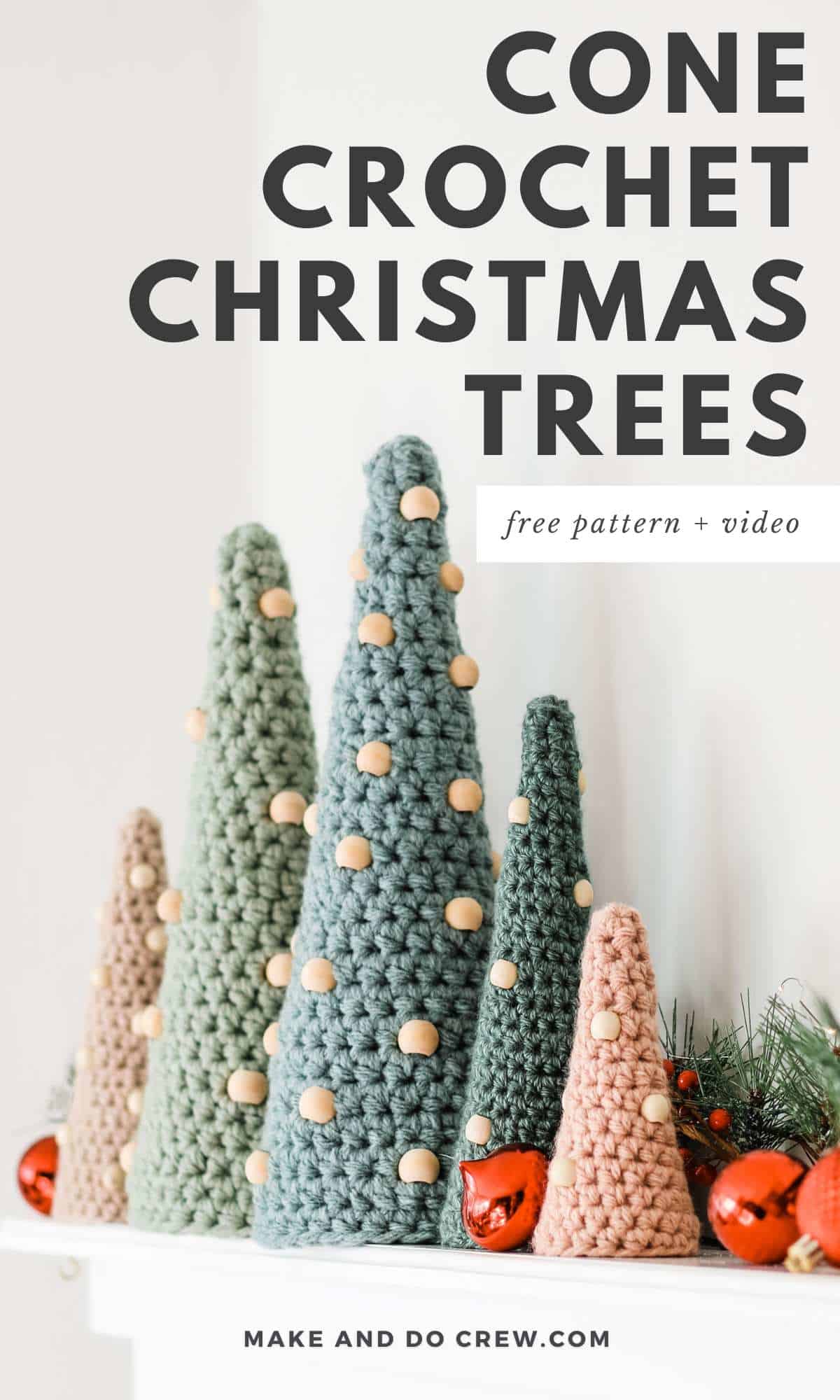 Five cone crochet Christmas trees in different colors and sizes placed on top of a fire place.