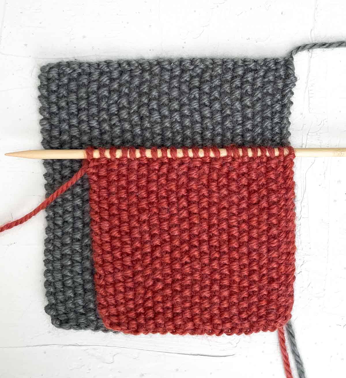 Two knit rectangles in different sizes and colors.