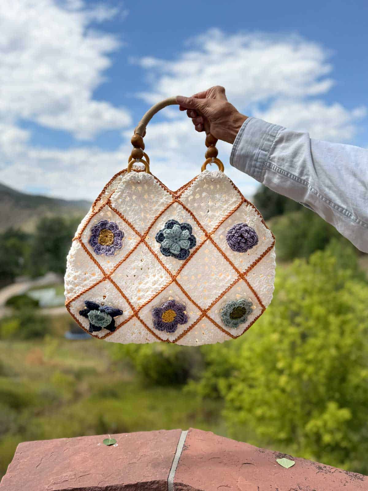 Crochet purse made from flower granny squares.