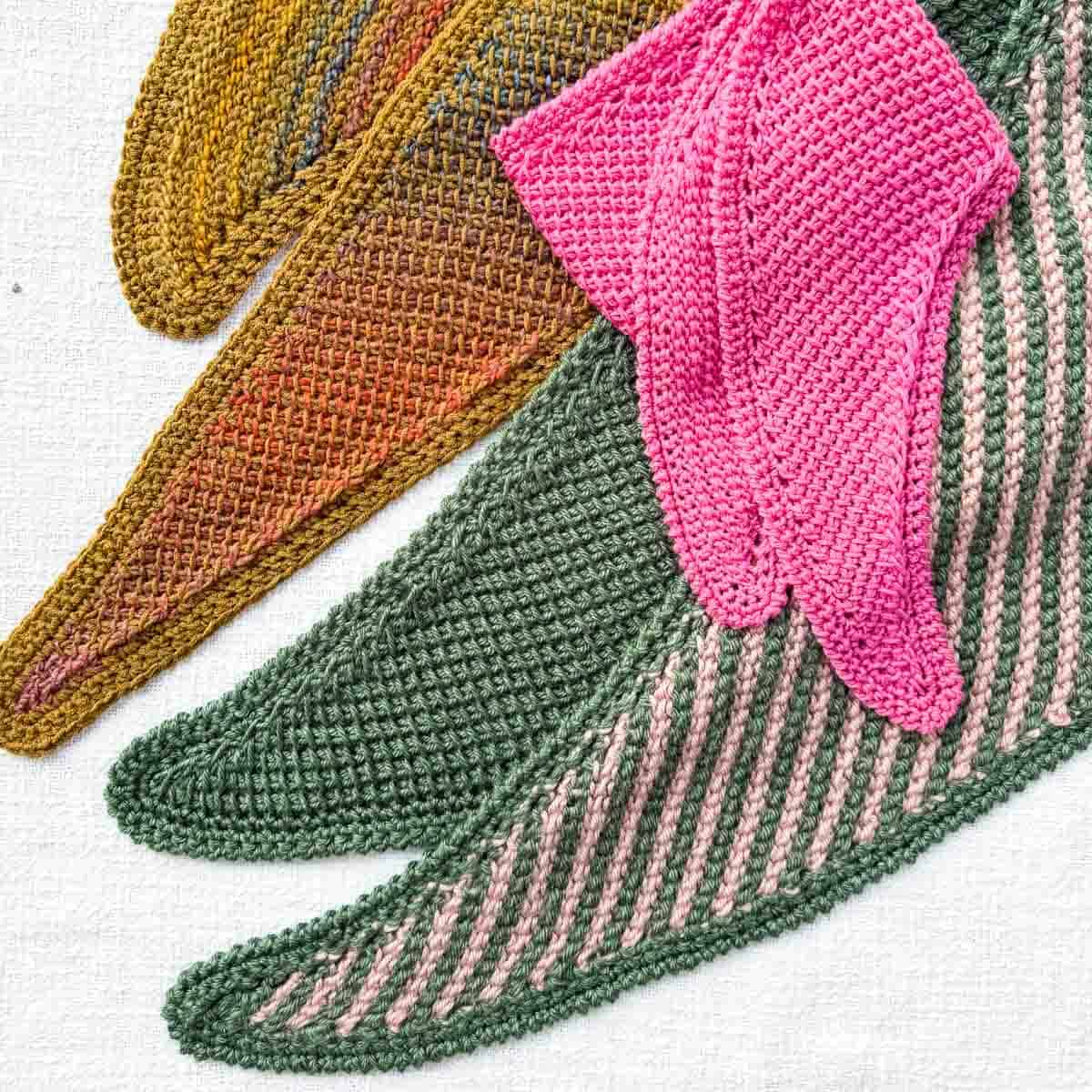 Three different Tunisian crochet scarves made with different yarns.