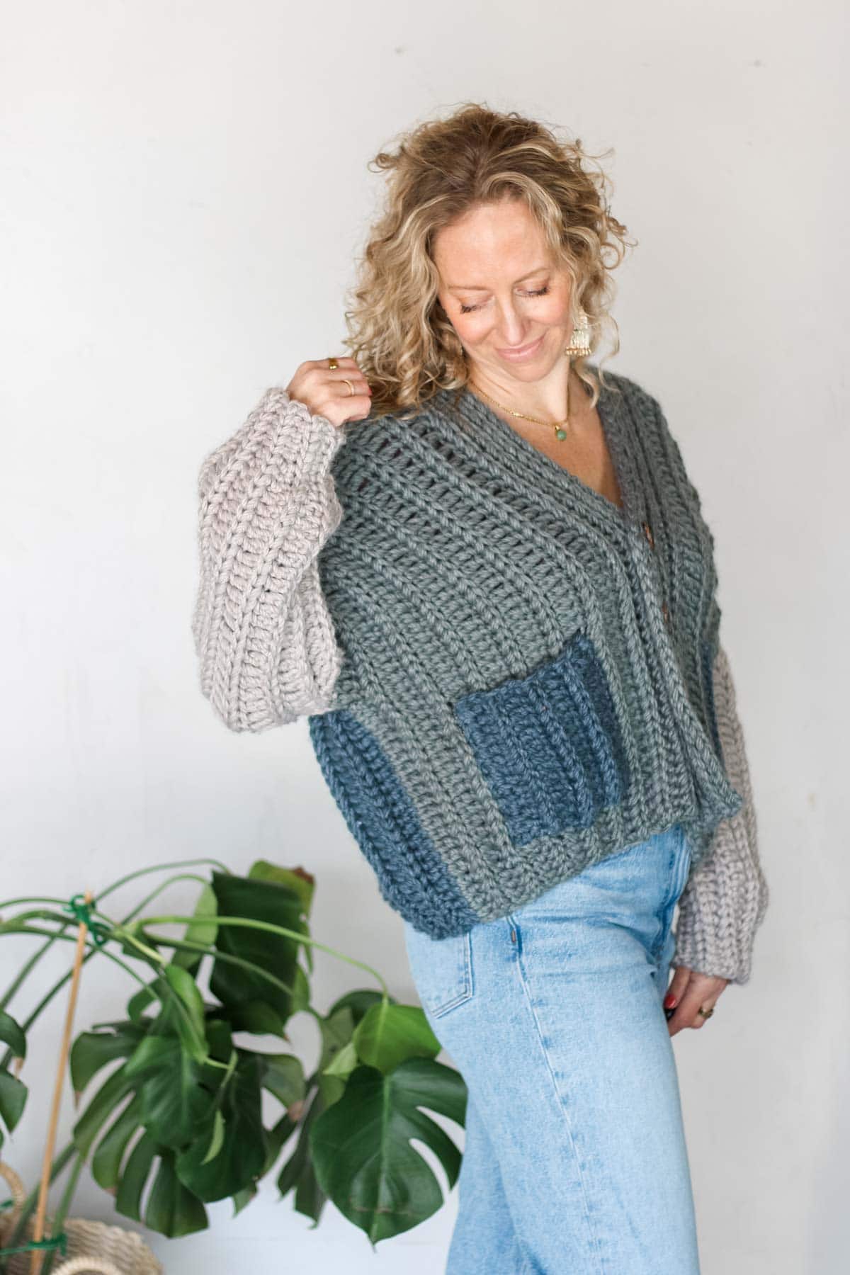 Ribbed, chunky crochet sweater with buttons down the front.