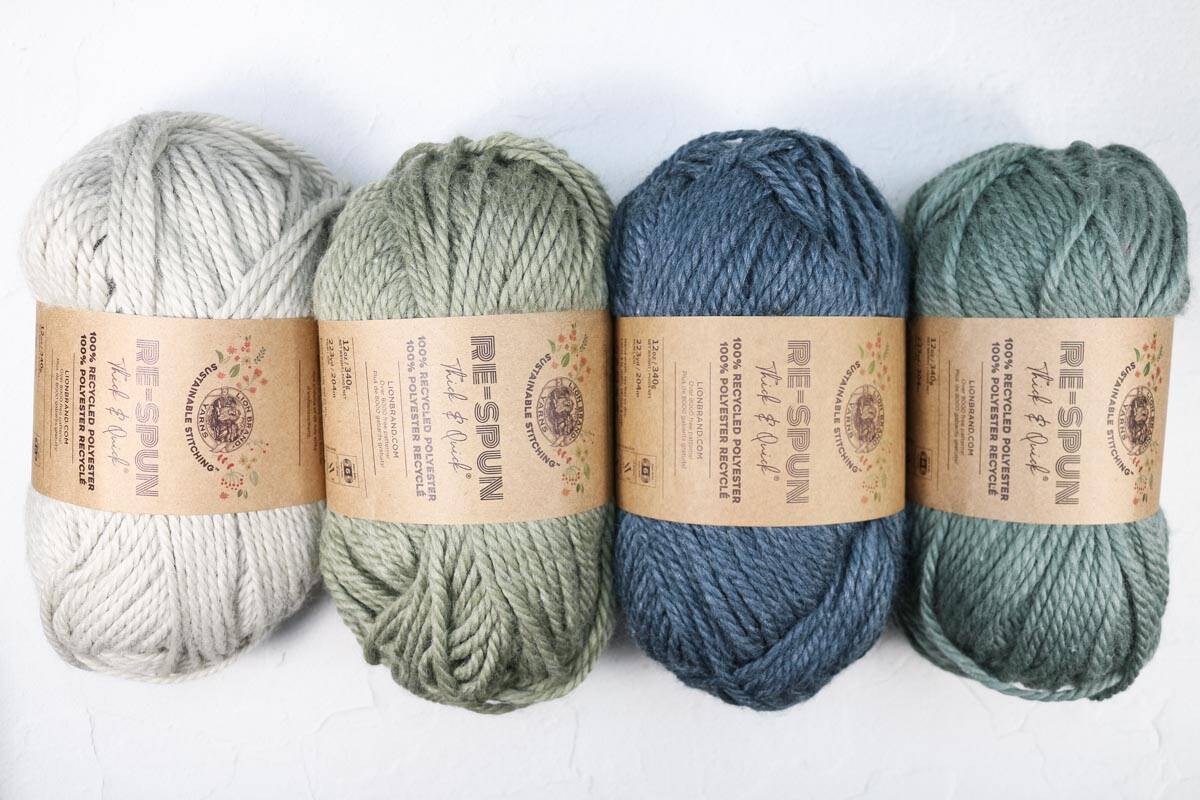 Lion Brand Re-Spun yarn balls lined up.