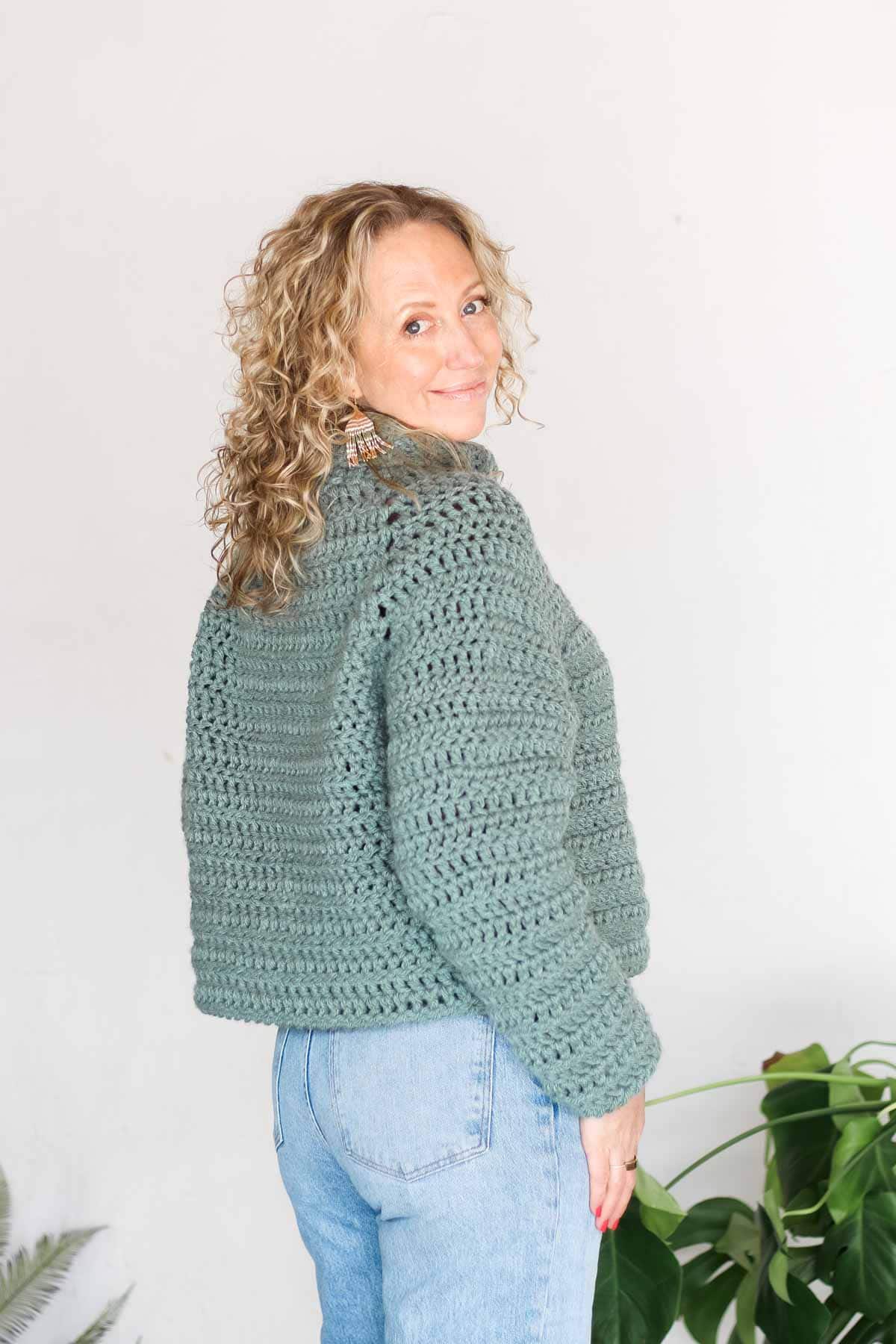 Back view of a top down raglan crochet sweater made with Hue + Me yarn.