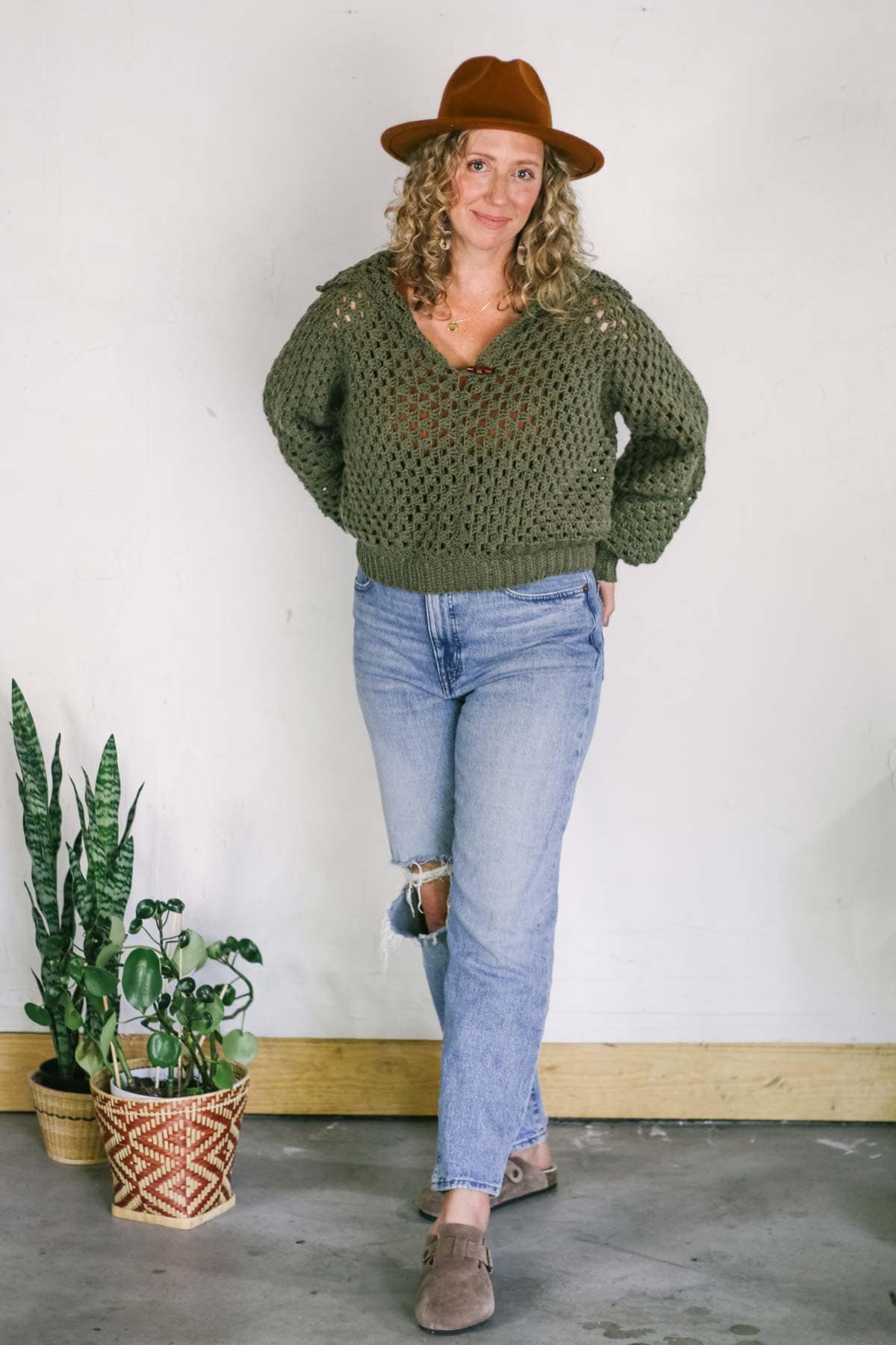 Jess Coppom wearing a granny stitch v-neck pullover sweater.