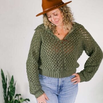 Muted green crochet pullover sweater made from two hexagons.