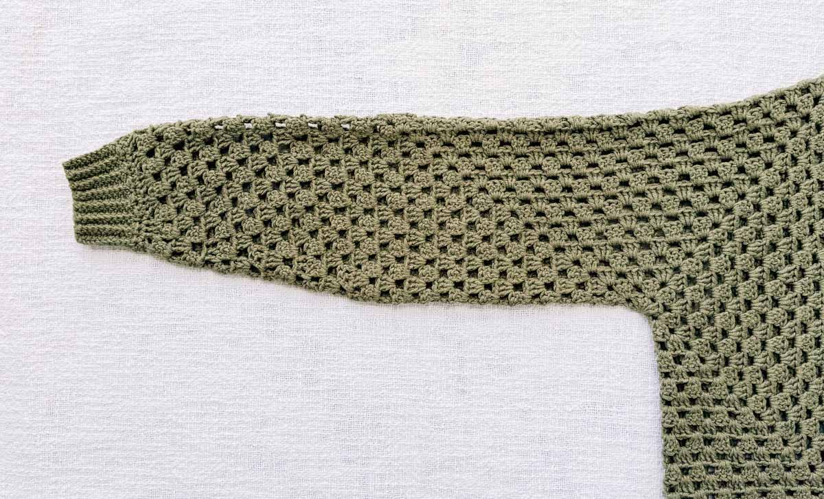 Tapered crochet granny stitch sweater sleeve.