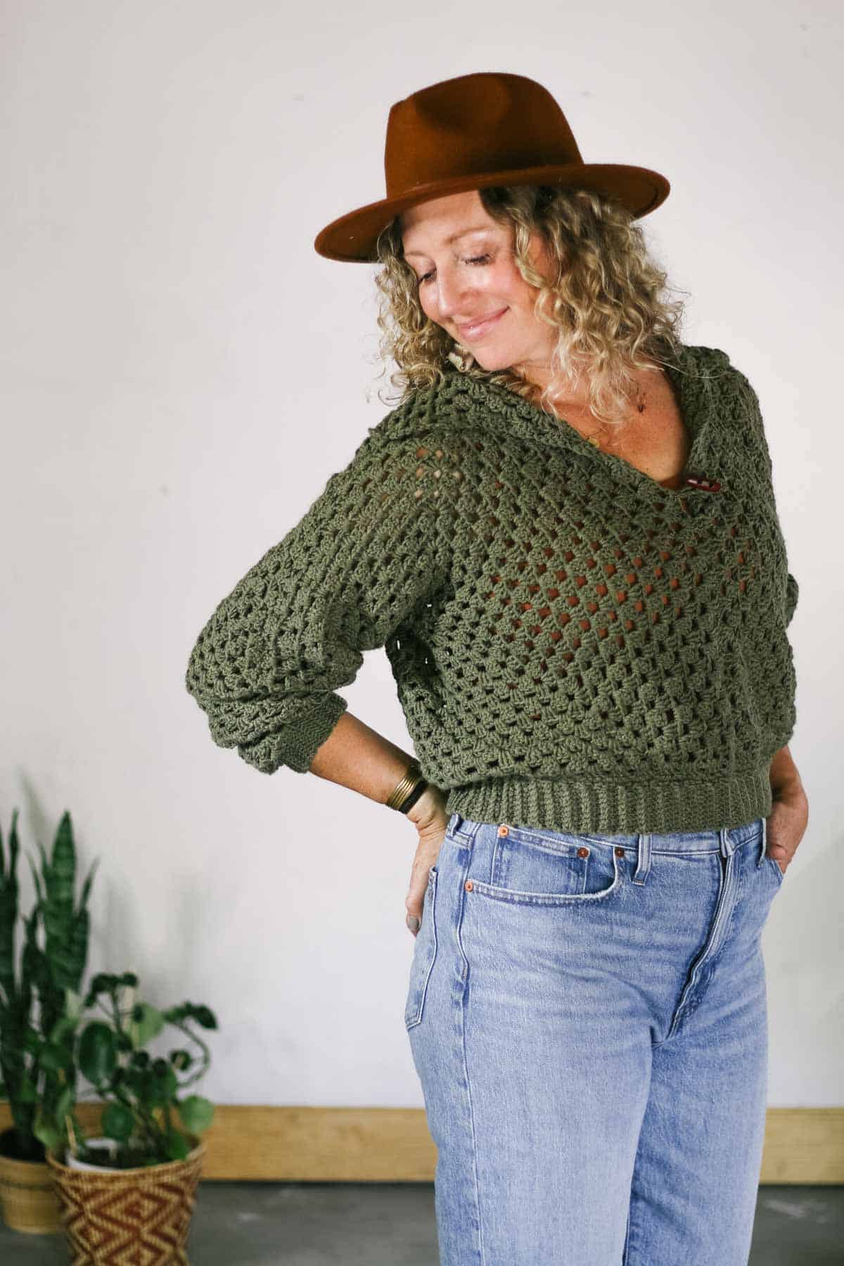 Green cropped crochet sweater made from two hexagons, modeled on Jess Coppom.