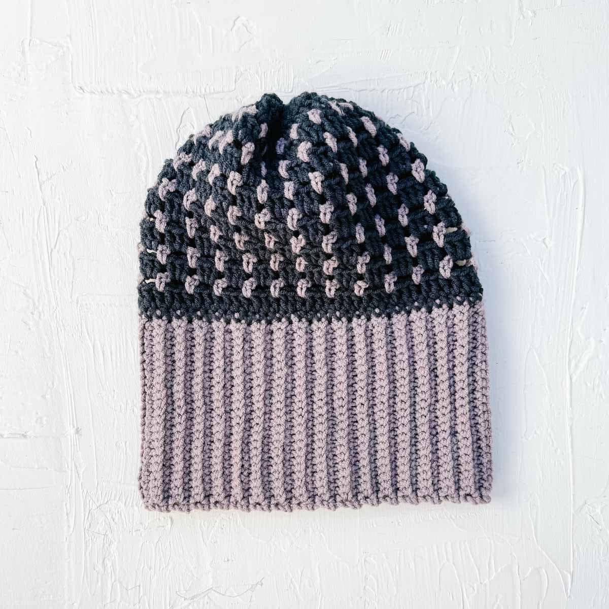 Two-color crochet hat with purple, fold over ribbed brim.