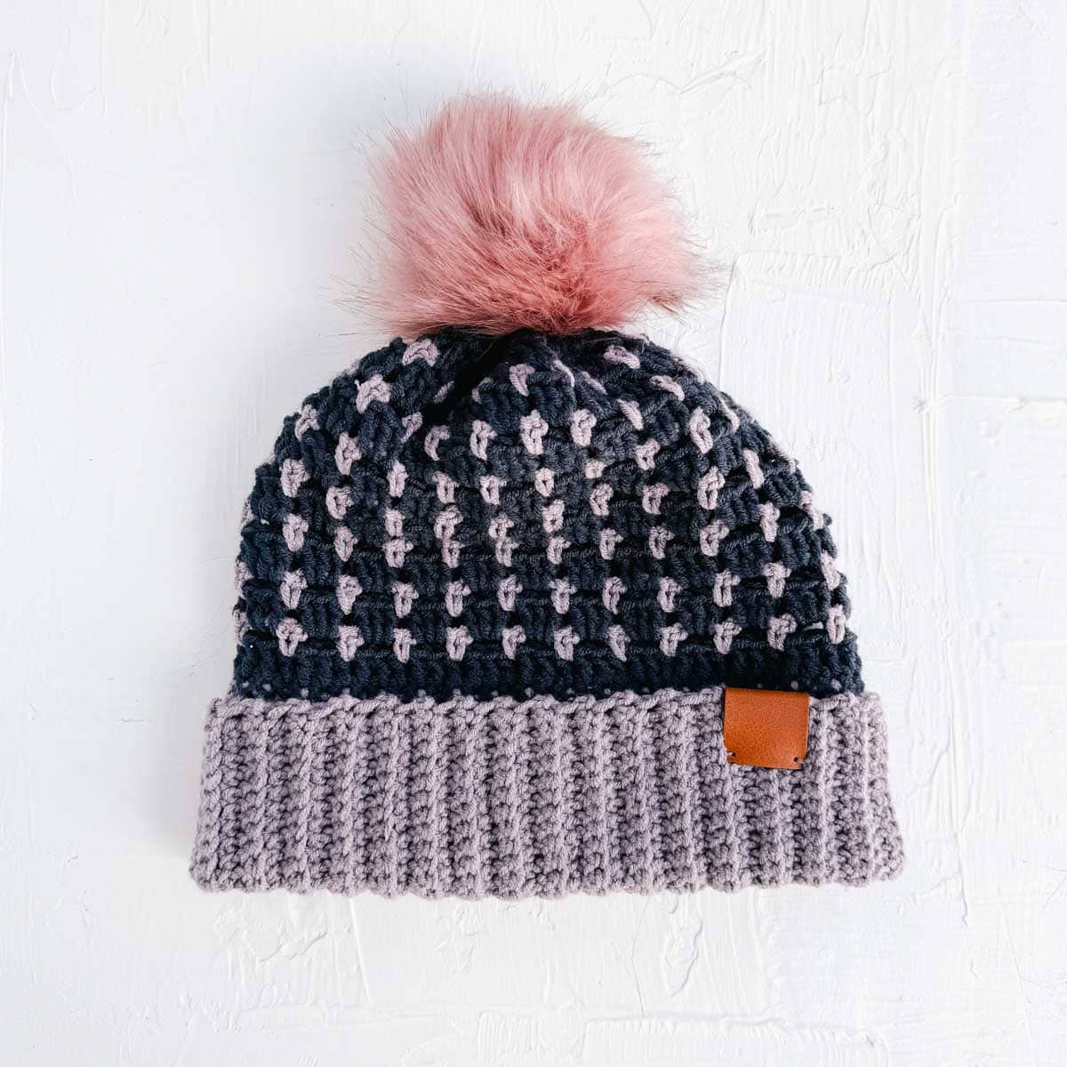 Navy and purple crochet beanie made with the block stitch.