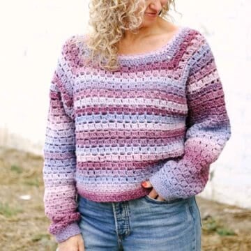 A crocheted raglan sweater made with Lion Brand Landscapes Renewed yarn.