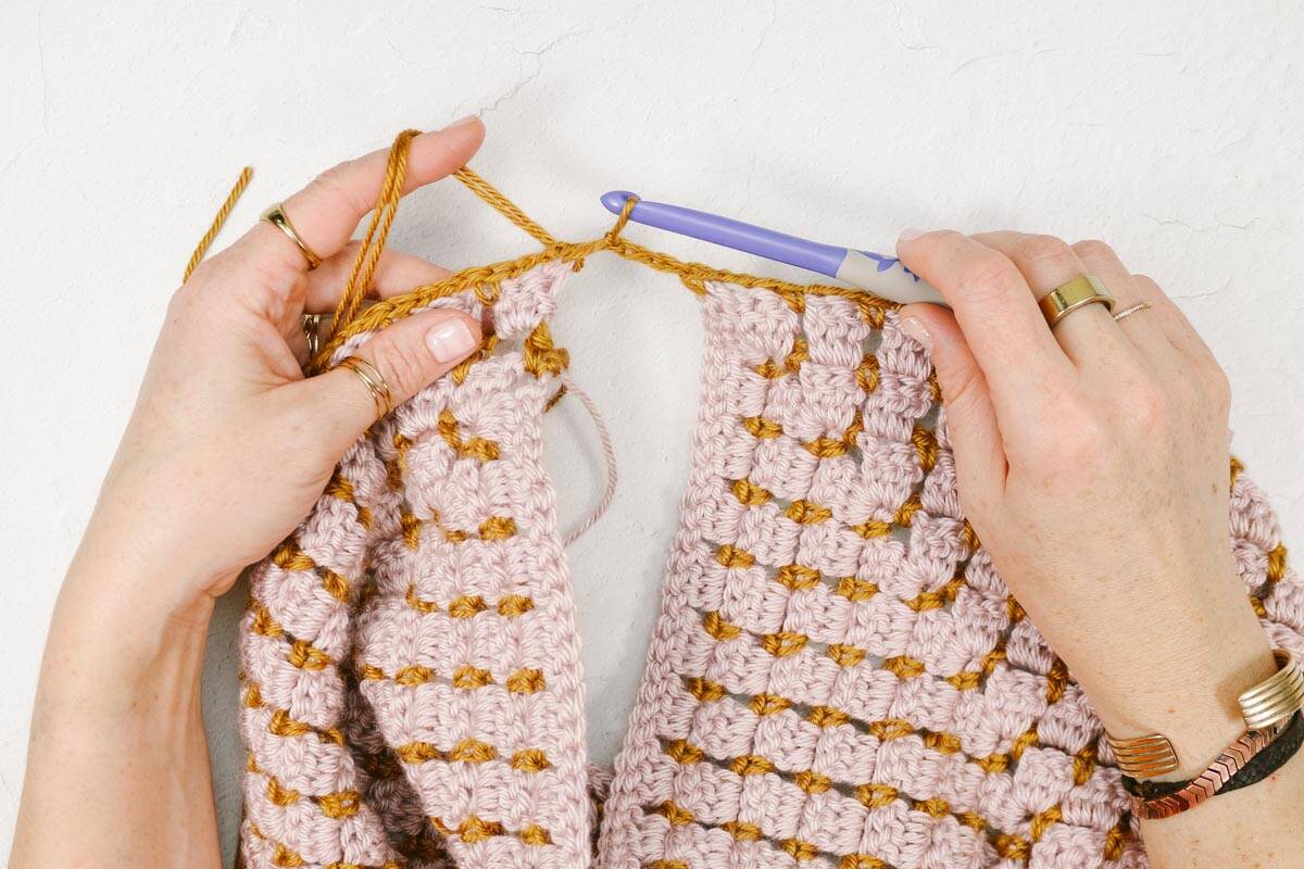 How to crochet armholes in a top-down raglan garment.