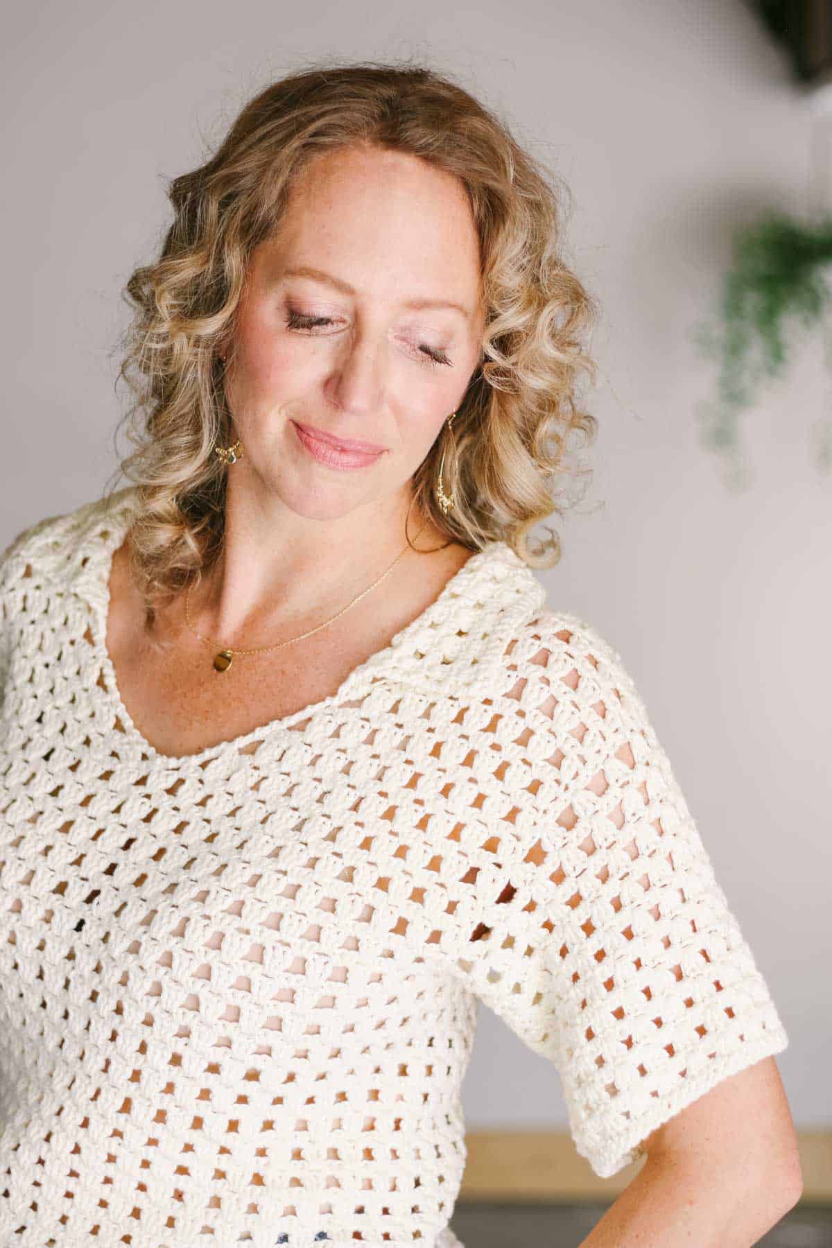 A collared v-neck crochet shirt worn by Jess Coppom.