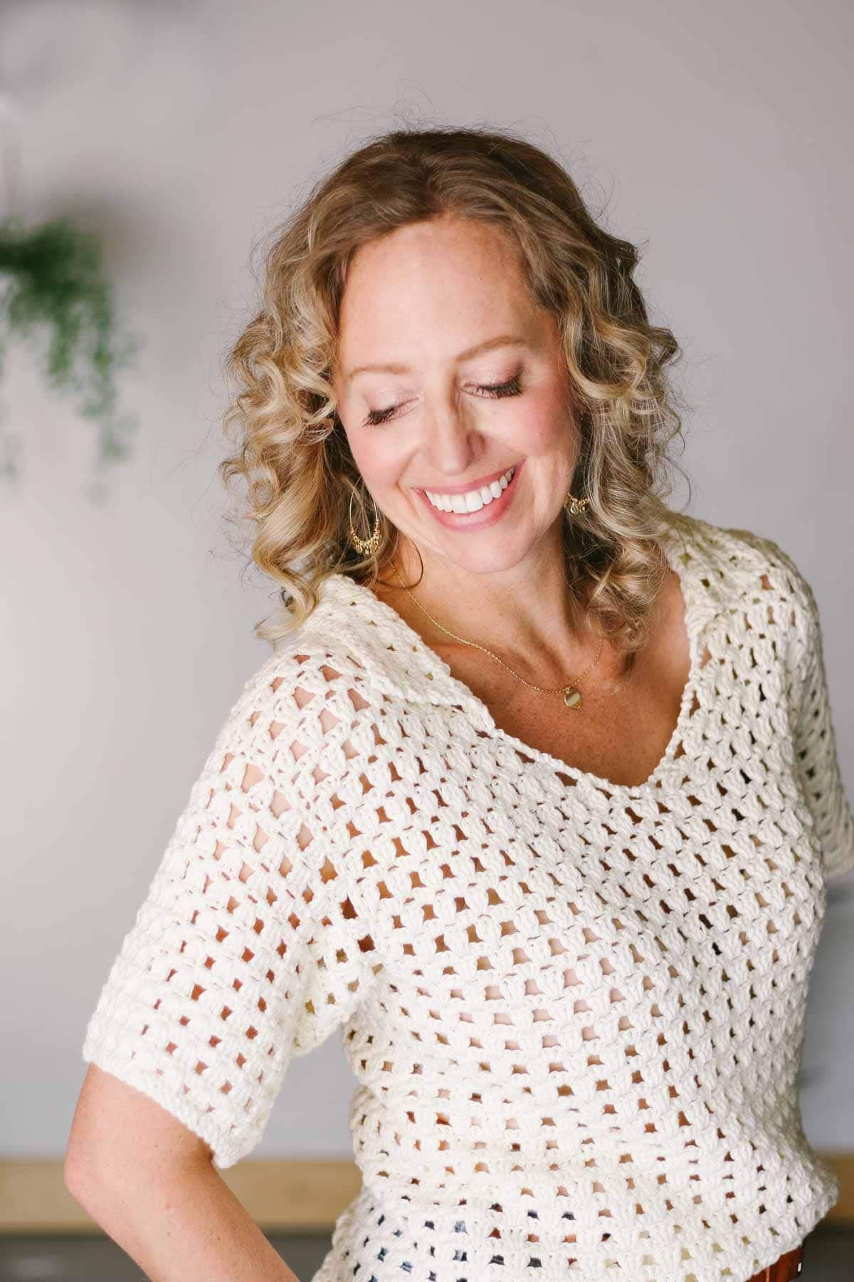 Mesh crochet shirt with a collar modeled by Jess Coppom.