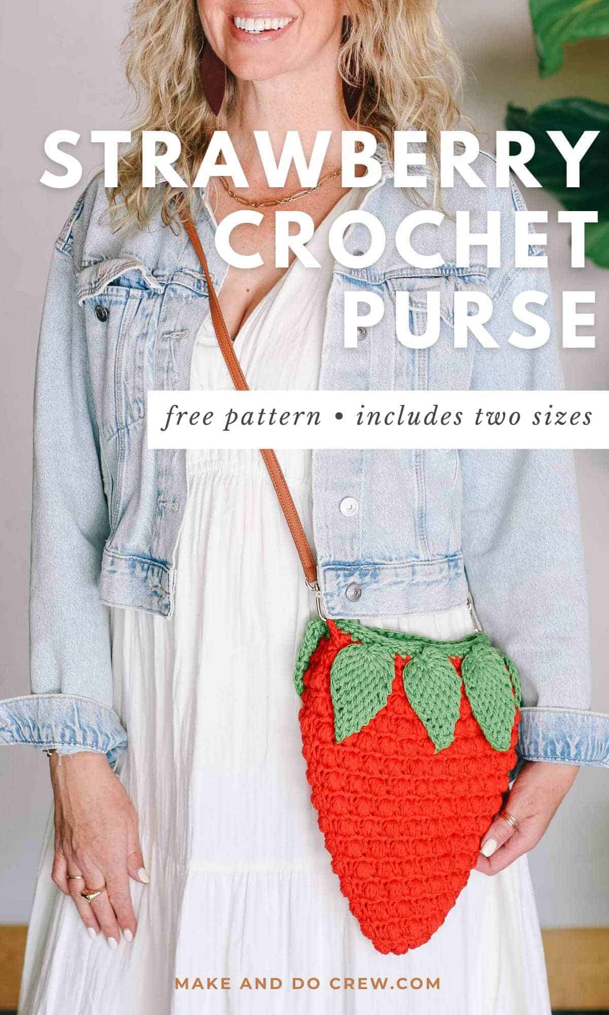 A strawberry crochet purse with leather strap worn by a blonde woman.