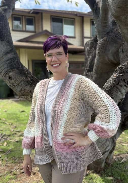 Crocheters wearing sweaters and cardigans they made themselves using Make & Do Crew patterns.